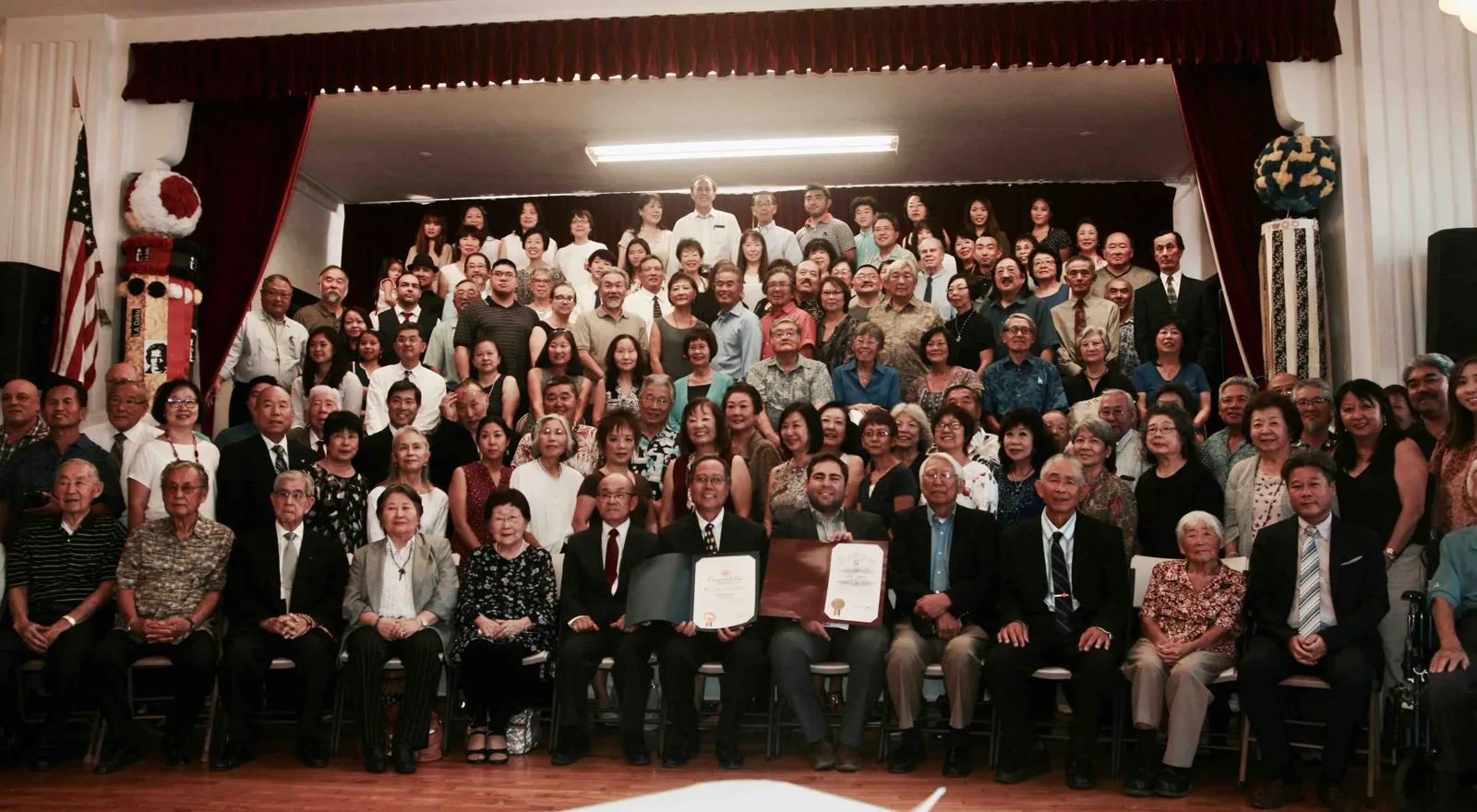 A large multigenerational community gathering in the Hollywood JCI Social Hall.